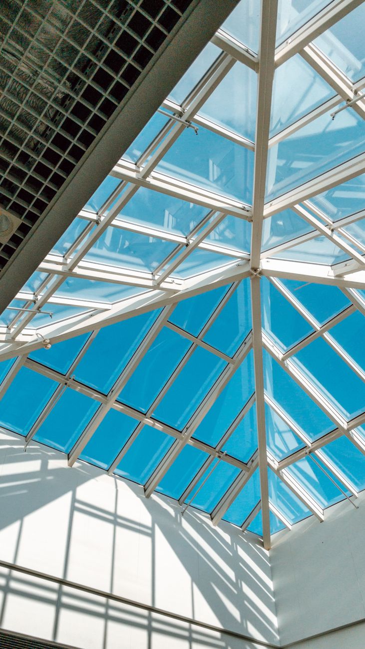 Translucent luminous ceiling illuminating modern commercial showroom