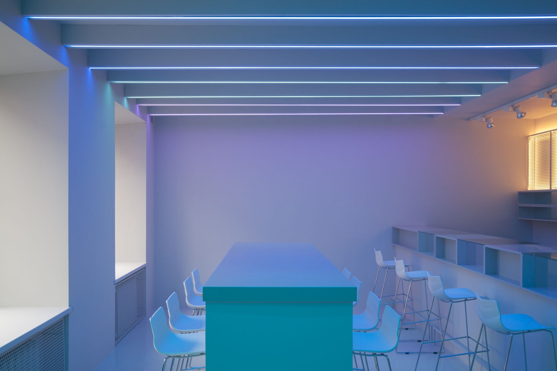 Recessed linear magnetic LED track lighting integrated in stretch ceiling